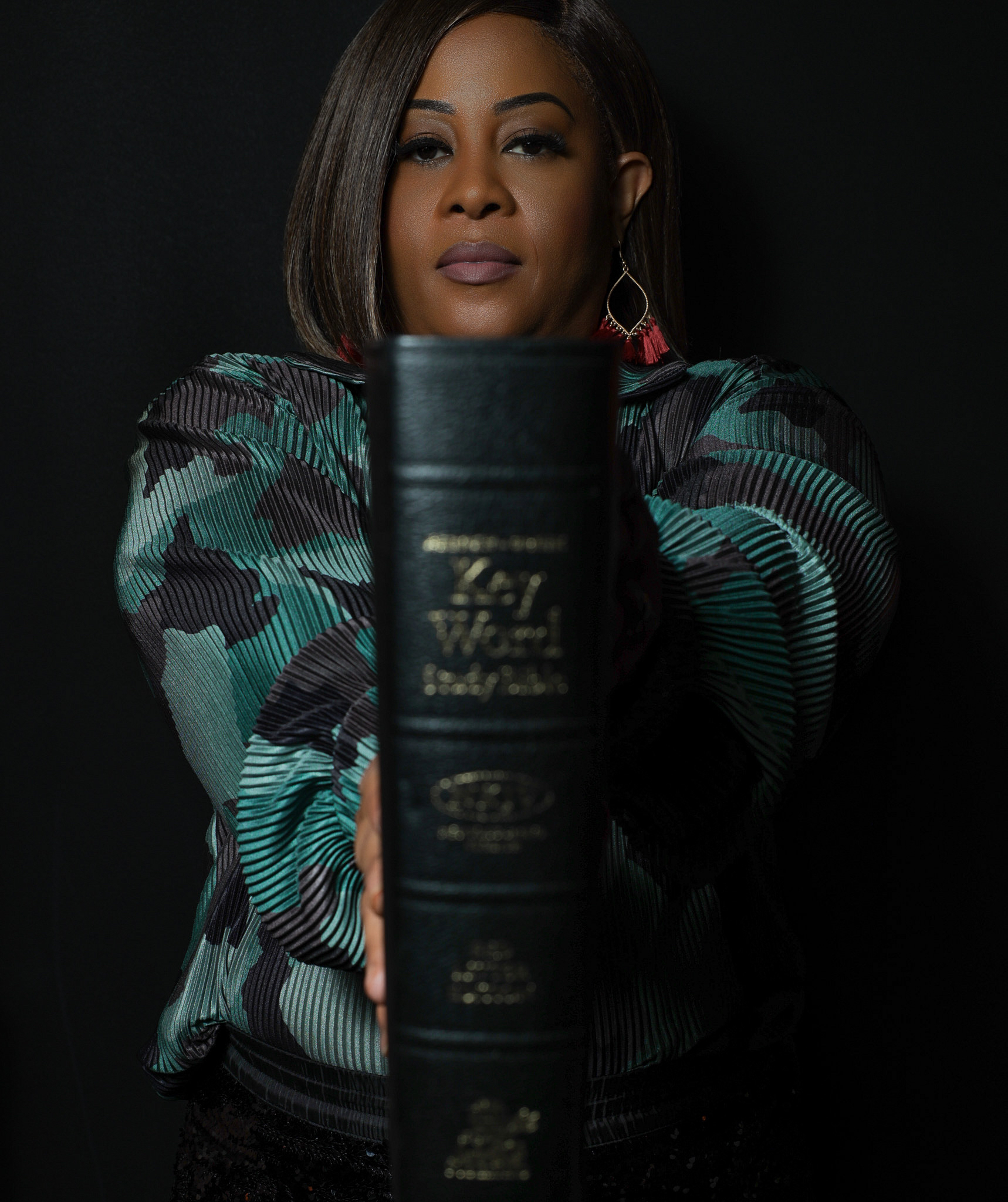 War Room Academy portrait with a Bible held forward